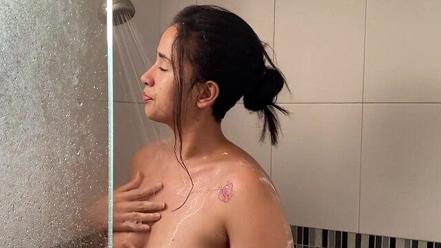 A lesbian calls her roommate to the shower and makes her fuck her