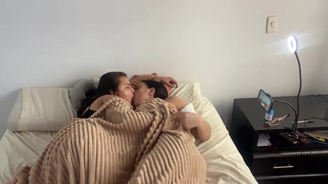 Lesbian sex under the covers on a cold morning