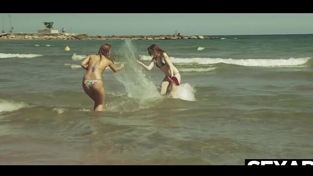 Watch these gorgeous beach babes enjoy passionate lesbian sex