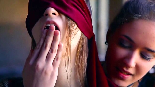 Straight girl is blindfolded by lesbian before she orgasms