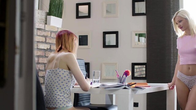 Cute redhead is distracted from her studies by sexy blonde who licks her pussy